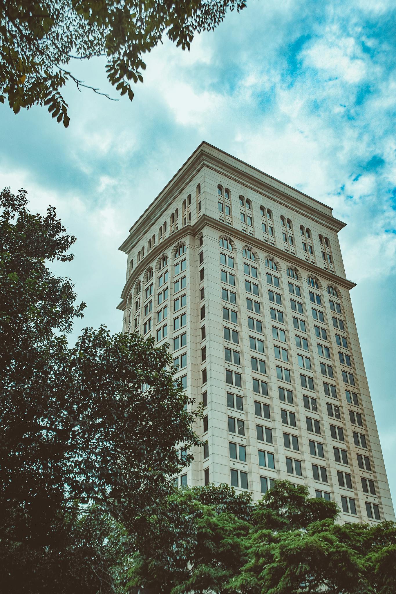 Modern tall building against blue sky